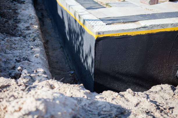 Professional Waterproofing technician working in Archbold, OH